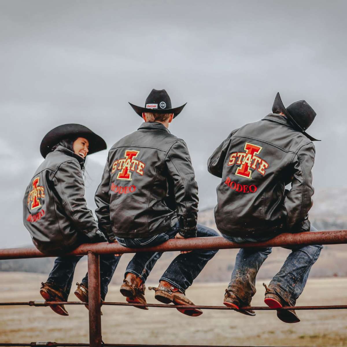 a candid photo of three members of the rodeo club